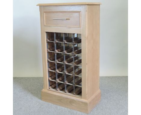 A light oak wine rack, 52cm