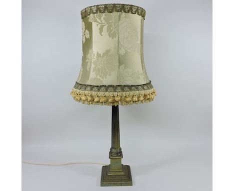 A 19th century brass corinthian column oil lamp, with a fringed shade, 81cm tall overall