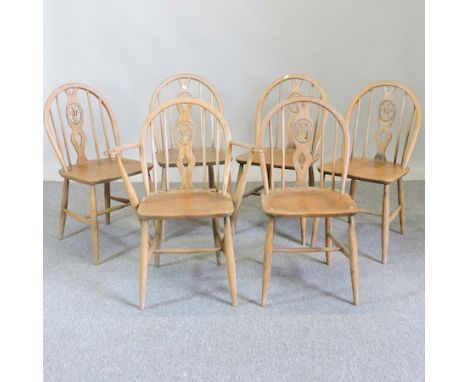 A set of six Ercol light elm dining chairs, to include a carver