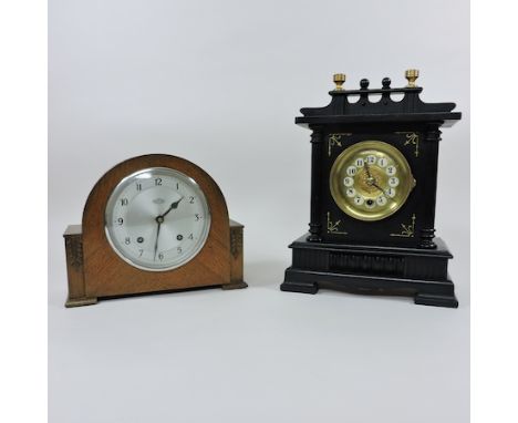 A Victorian ebonised mantel clock, with a brass dial, 35cm tall, together with a 1930's oak mantel clock