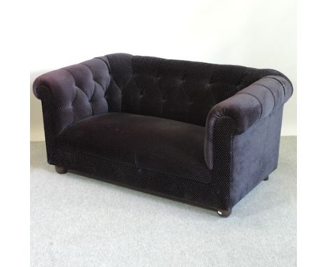 A Victorian style black velvet button back Chesterfield sofa, 148cm