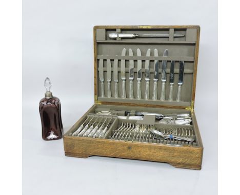 A mid 20th century Mappin & Webb canteen of silver plated cutlery, together with a ruby glass decanter with a silver collar