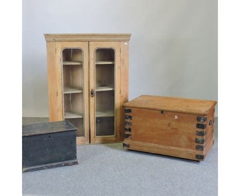 A pine glazed bookcase, 84cm, together with a pine iron bound trunk and another