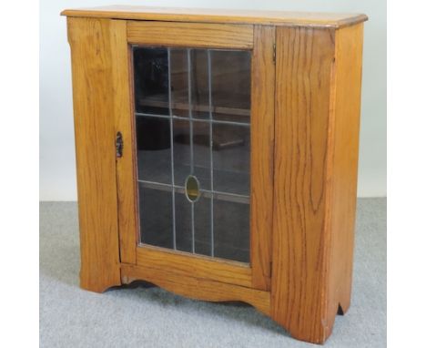 A 1920's light oak glazed cabinet, 90cm