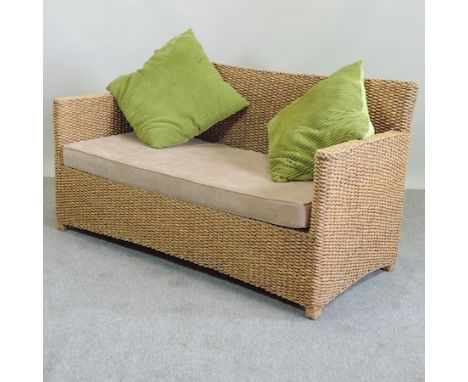 A Rattan sofa, with suede cushions, 154cm