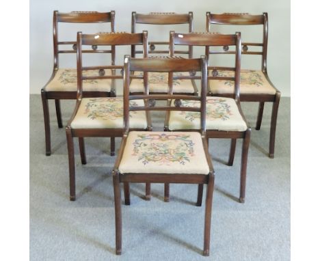 A set of six mahogany and tapestry upholstered dining chairs