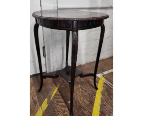 A mahogany Regency-style  occasional table. Damage to surface. 