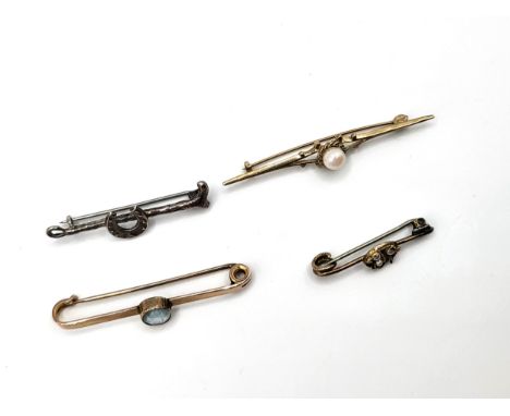 Four pins including 9ct gold pin 5.2mm pearl, rose gold (unmarked) tie pin with oval cut blue paste, a clover leaf and seed p