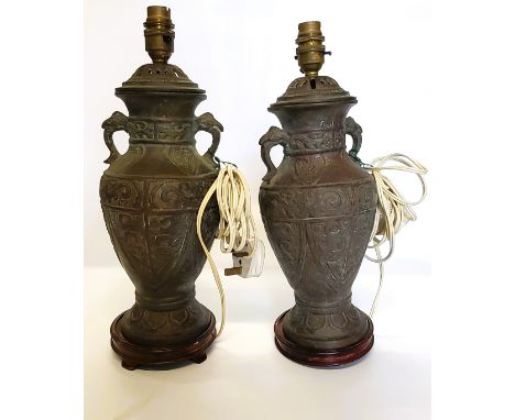 Two brass lamps.Feet missing on the base of one lamp