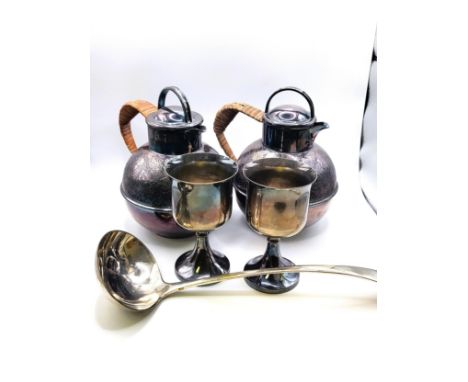 A pair of silver plate tea pots, two pint capacity, with bamboo woven handles and ornately machine-engraved upper half approx