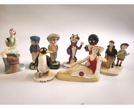 Seven Royal Doulton figures including Frosties' Tony the Tiger and Coalport Farewell Golly with original boxes and certificat