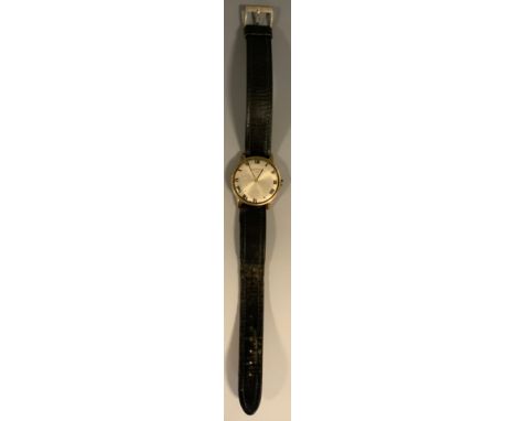 A Rotary 9ct gold cased wristwatch, 33mm diameter case, silver dial, bold Roman numerals, 17 jewel manual wind movement, 9ct 