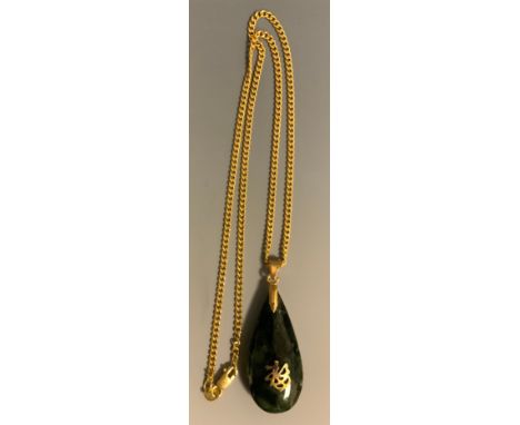 A Chinese green stone possibly nephrite jade pear drop pendant necklace, unmarked yellow metal loop suspended from a 9ct gold