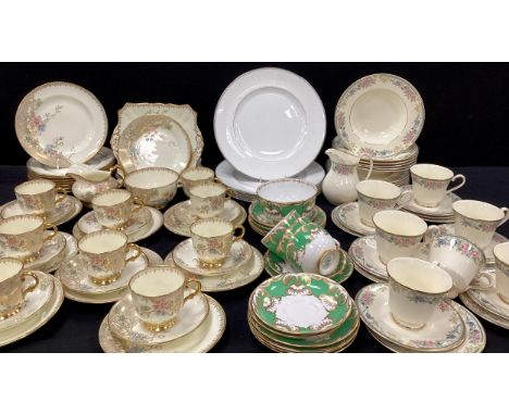 A Royal Doulton ‘Eleanor’ tea service for six including; six tea cups and saucers, side plates, six bowls; a set of six Water