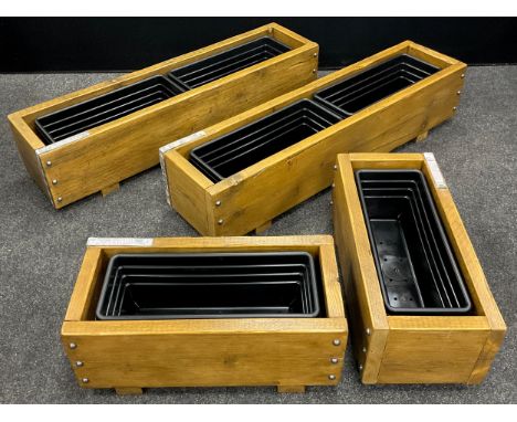 A pair of wooden trough planters, constructed from up-cycled scaffold boards, 25.5cm high x 114cm long x 28cm wide;  another 