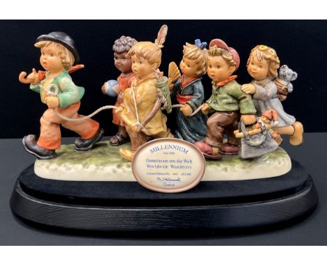 Hummel Goebel limited edition figure group of ‘Worldwide Wanderers’, No.452/2000, marks the millennium, on black oval plinth,