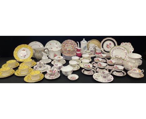 Tea ware including; five gilt, yellow and floral tea cups and saucers, conforming picnic plates, black and floral tea ware fo
