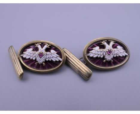 A pair of silver and enamel cufflinks, bearing Russian marks. Each 2.5 cm wide.