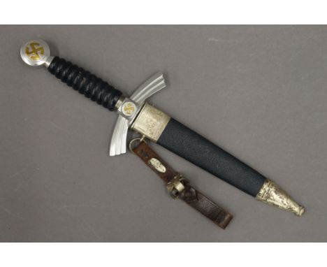 A German dagger with associated scabbard. 35.5 cm long.