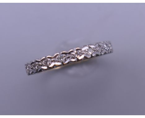 An 18 ct gold and diamond half hoop eternity ring. Ring size K.