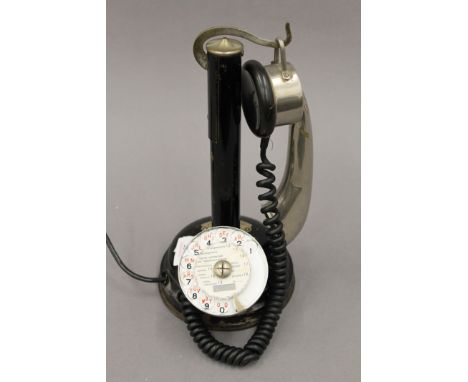 An early 20th century French Thompson-Houston stick desk telephone, reg no 83827. 28.5 cm high.