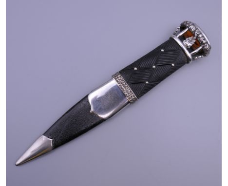 A Scottish skean dhu, retailed by Scott Adie Ltd, London (Royal Scotch Warehouse). 19 cm long.