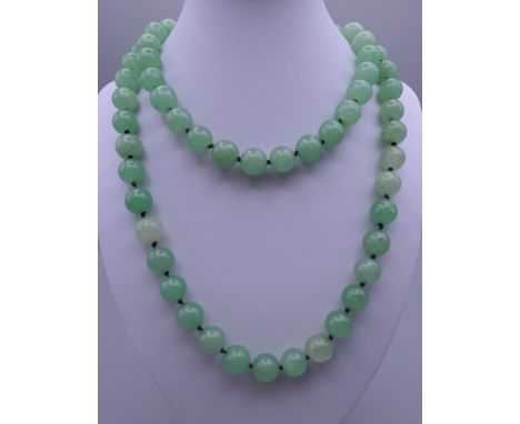 A string of jade beads. Approximately 88 cm long.