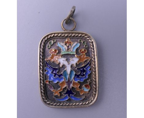A silver and enamel pendant, bearing Russian marks. 3.5 cm high.