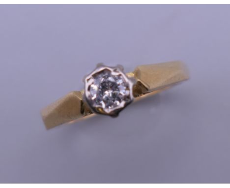 An 18 K gold diamond solitaire ring. Ring size L/M.