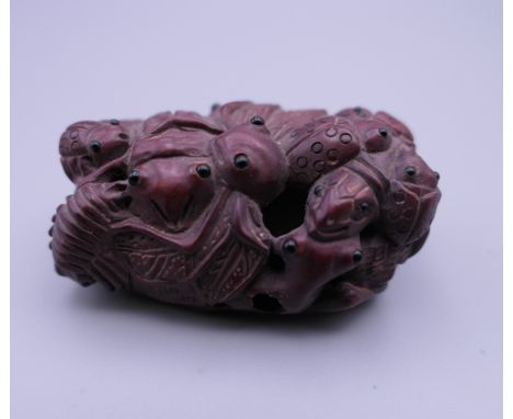 A small wooden netsuke formed as insects. 5 cm long.
