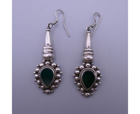 A pair of silver and jade earrings. 4.5 cm high.