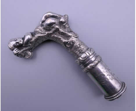 A silver plated walking stick handle. 11.5 cm high.