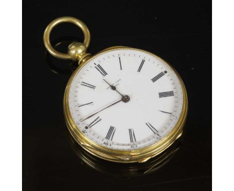 A Swiss gold key wound open-faced fob watch, 32mm diameter, with a circular barley engine turned black case, with a central e