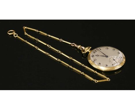 An 18ct gold Art Deco open-faced pocket watch, 44mm diameter. A silvered dial with black Arabic numerals, blued Breguet-style