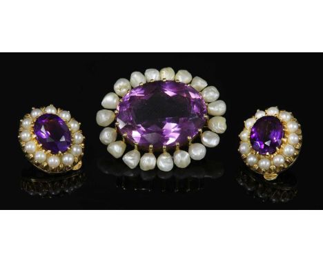 A late Victorian gold amethyst and pearl oval brooch, c.1950, possibly American, with an oval mixed cut amethyst, claw set to