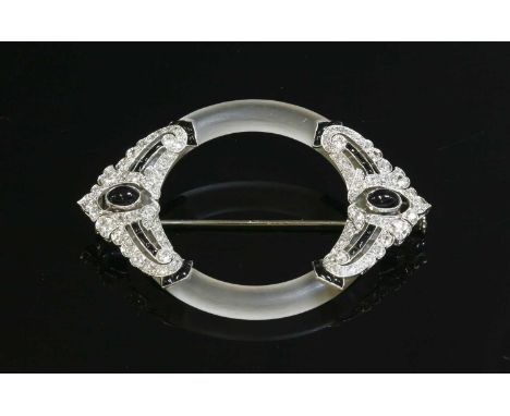 A French Art Deco platinum, gold, rock crystal, onyx and diamond brooch, c.1925, a frosted rock crystal hoop with a matching 