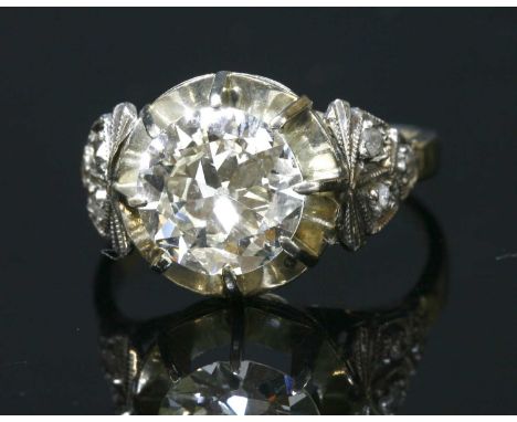 A single stone diamond ring, c.1915, with a brilliant cut diamond, estimated as approximately 1.67ct, eight claw set to an op