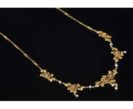 A French Belle Époque gold and pearl, rose bloom necklace, with five graduated central plaques. Each one composed of naturali