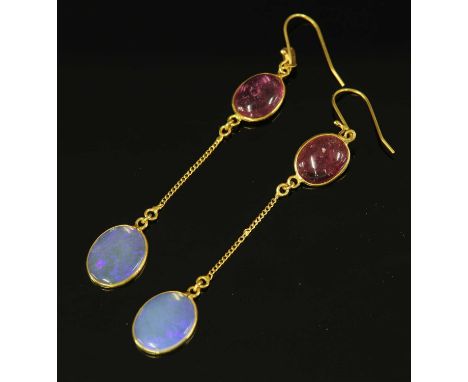 A pair of gold tourmaline and opal drop earrings, with an oval cabochon pink tourmaline, spectacle set to the top. Filed curb