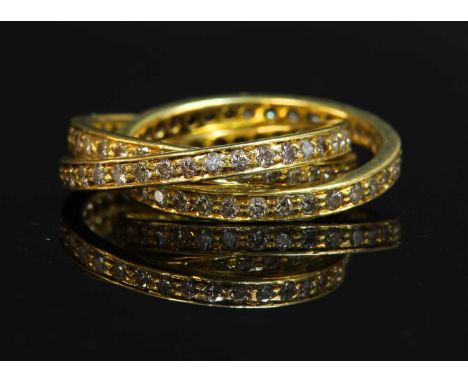 A gold diamond set Russian wedding ring, with three interlocking hoops, each one grain set with a row of brilliant cut diamon