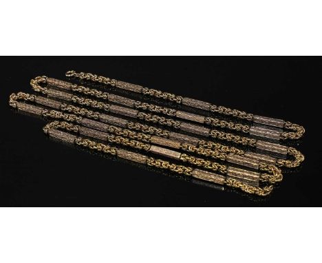 A 9ct gold fancy link long chain, with foliate square section bar links between lengths of Byzantine chain, to bolt ring clas