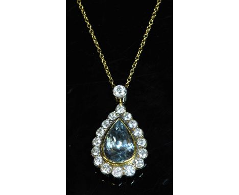 A yellow and white gold aquamarine and diamond pendant, with a pear cut aquamarine, with a stated weight of 3.50ct, milligrai