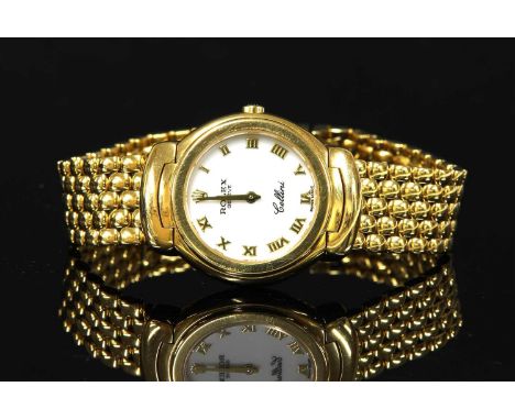 A ladies' 18ct gold Rolex Cellini quartz bracelet watch, model no. 6621/8, c.2004. The circular case, 27mm in diameter, with 