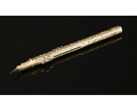 A Victorian gold-cased dip pen/pencil, with an engraved barrel and two scrolling push pieces. 91mm long
