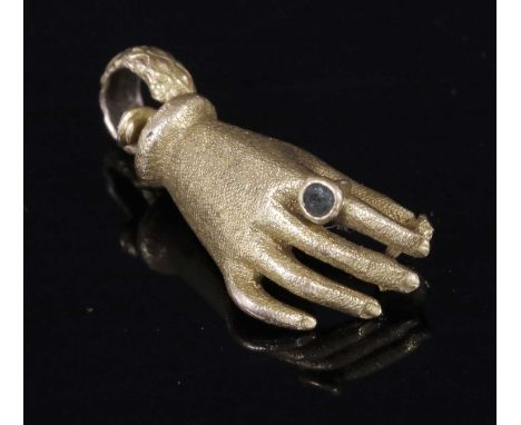 A Georgian or Regency gold hand clasp from a long chain, with one wave textured link to the tongue. A circular mixed cut emer