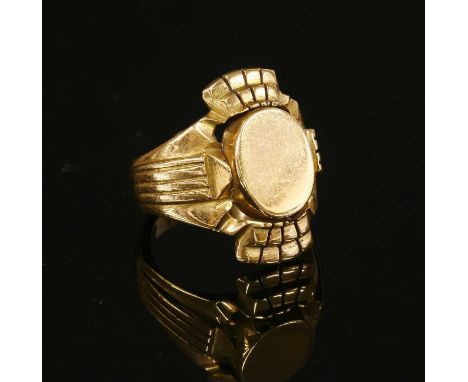 A gentlemen's Continental gold signet ring, with a central flat section oval head. Four stepped fan shapes to the top and bot