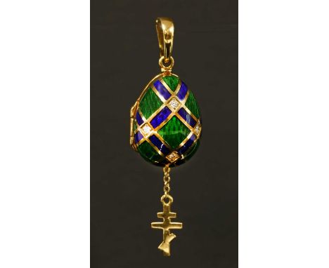 A cased 18ct gold diamond and enamel contemporary egg pendant, by Victor Mayer for Fabergé. The hinged egg with blue champlev