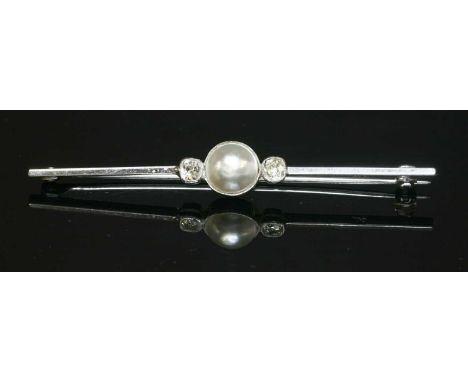 A white gold cultured pearl and diamond bar brooch, with a cultured pearl, milligrain set to the centre. A cushion cut diamon