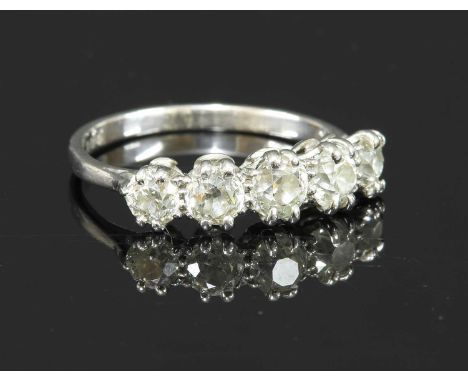 A five stone graduated diamond ring, with five graduated old European cut diamonds, all double claw set to coronet collets, w