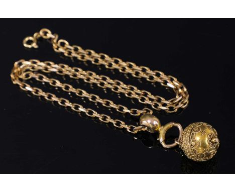 A Victorian Etruscan Revival gold bead pendant, c.1860, on a later 9ct gold faceted trace chain. The bead pendant with horizo